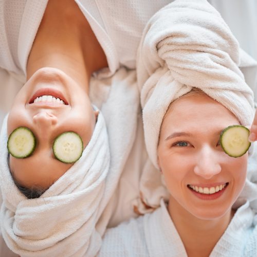 Friends, face and teenager, girl and facial, pampering and beauty, cucumber in portrait for skincar