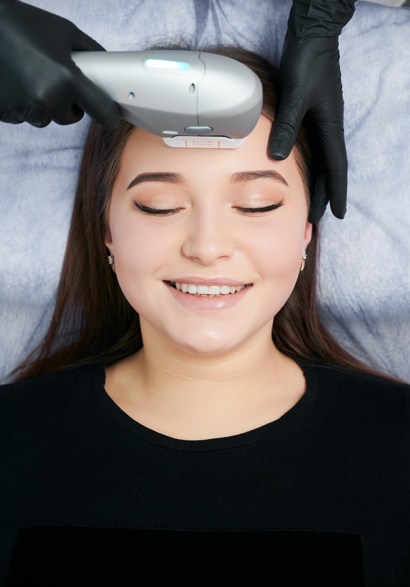 Woman receiving a relaxing facial treatment.