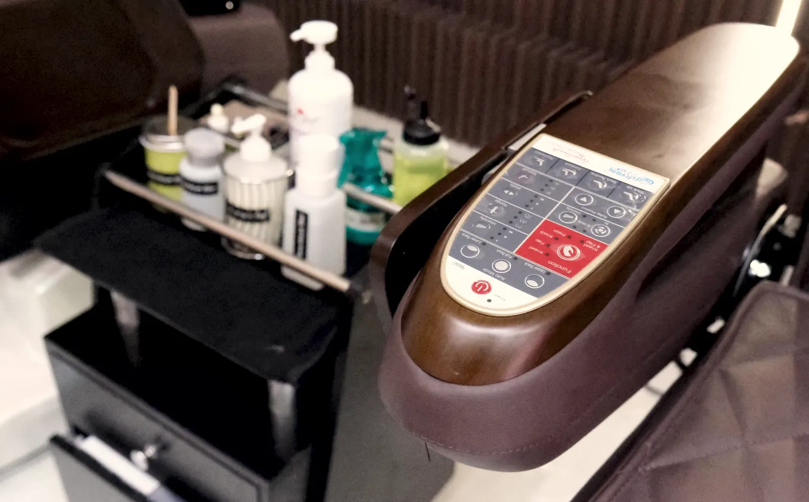 A pedicure chair at Beautique Bar on Yonge, with the care products ready on the tray