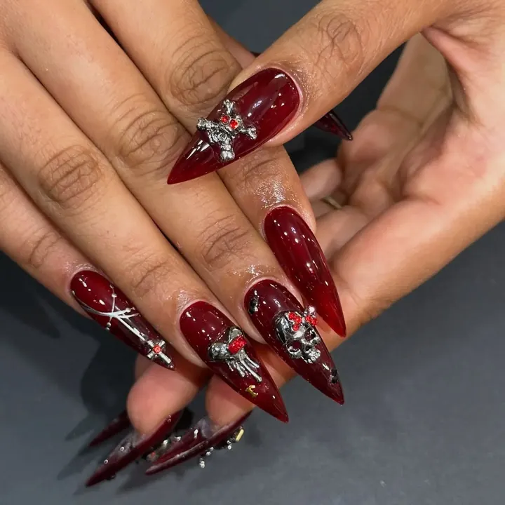 Nails by Beautique Bar: jewelled red stiletto