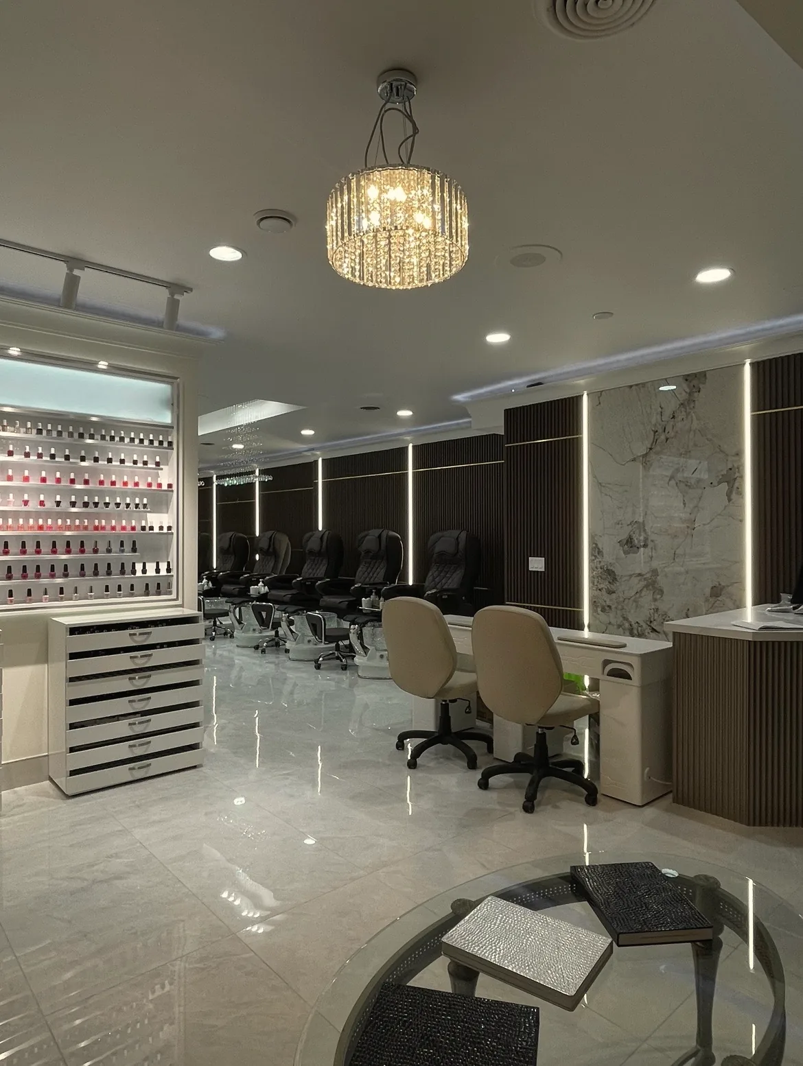 Inside Beautique Bar on Yonge: the colour wall, chandelier and stations